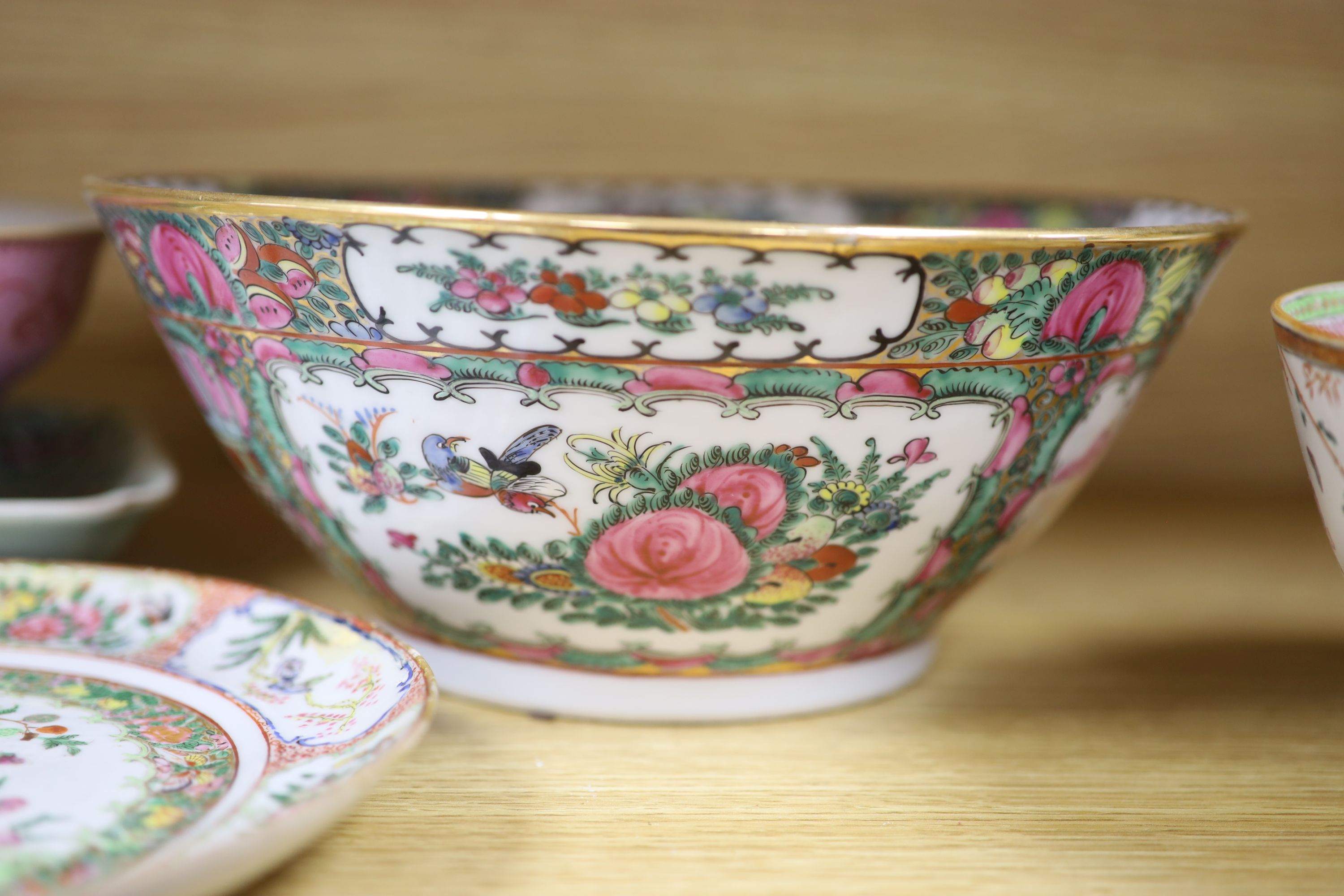 A Chinese pink ground bowl, late 19th century together with two other bowls, a famille verte dish and a plate